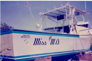 Miss Marine Diesel — the shop mascot vessel on stands in Cayman